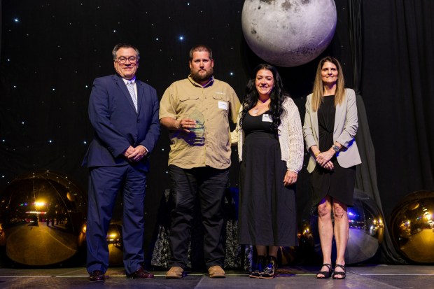 The 2026 GRCA Business Excellence Award's small business winners Doug and Rachel Brown (middle left and middle right, respectively) of Blades of Steel Landscaping celebrate with GRCA COO Sally Stewart and Jeff Rush, Chairman of the Board. (Courtesy of Wayne Becker, Zerbe Studio of Photography)