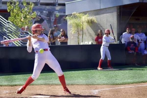 Alexis Huey #15 walks to first base after getting hit in the wrist with the ball on May 8, 2026.