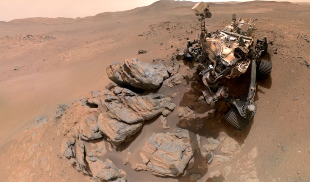 NASA’s Perseverance Rover Is About To Finish A Marathon NASA's Perseverance rover captured this selfie as it looks down at a rocky outcrop named Arathusa. The image is composed of 61 images taken on March 11th. Arathusa may predate the formation of Jezero Crater, the larger landscape feature that Perseverance is exploring. Image Credit: NASA/JPL-Caltech/MSSS