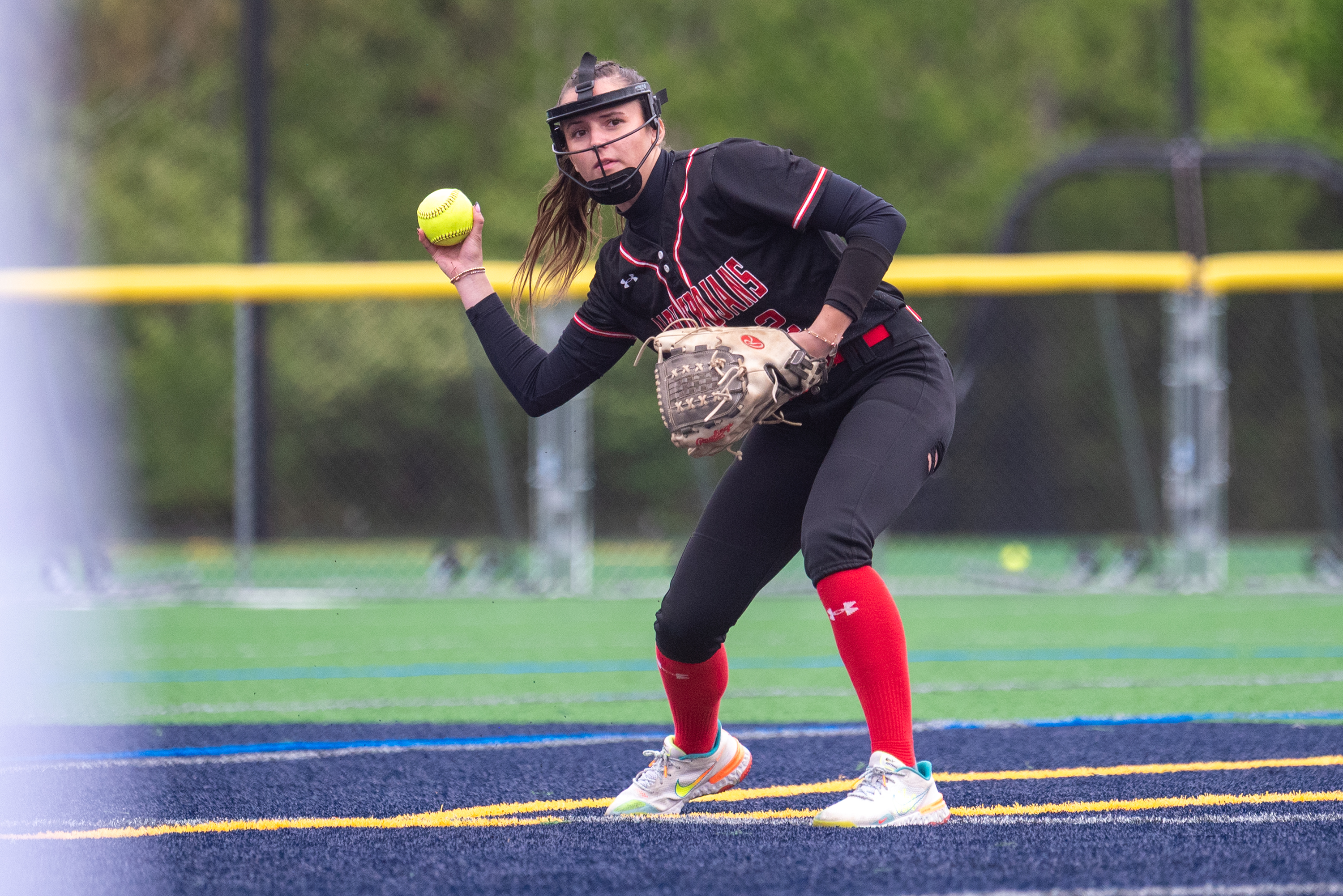 North Pocono’s Olivia Charles throws the ball to first base...