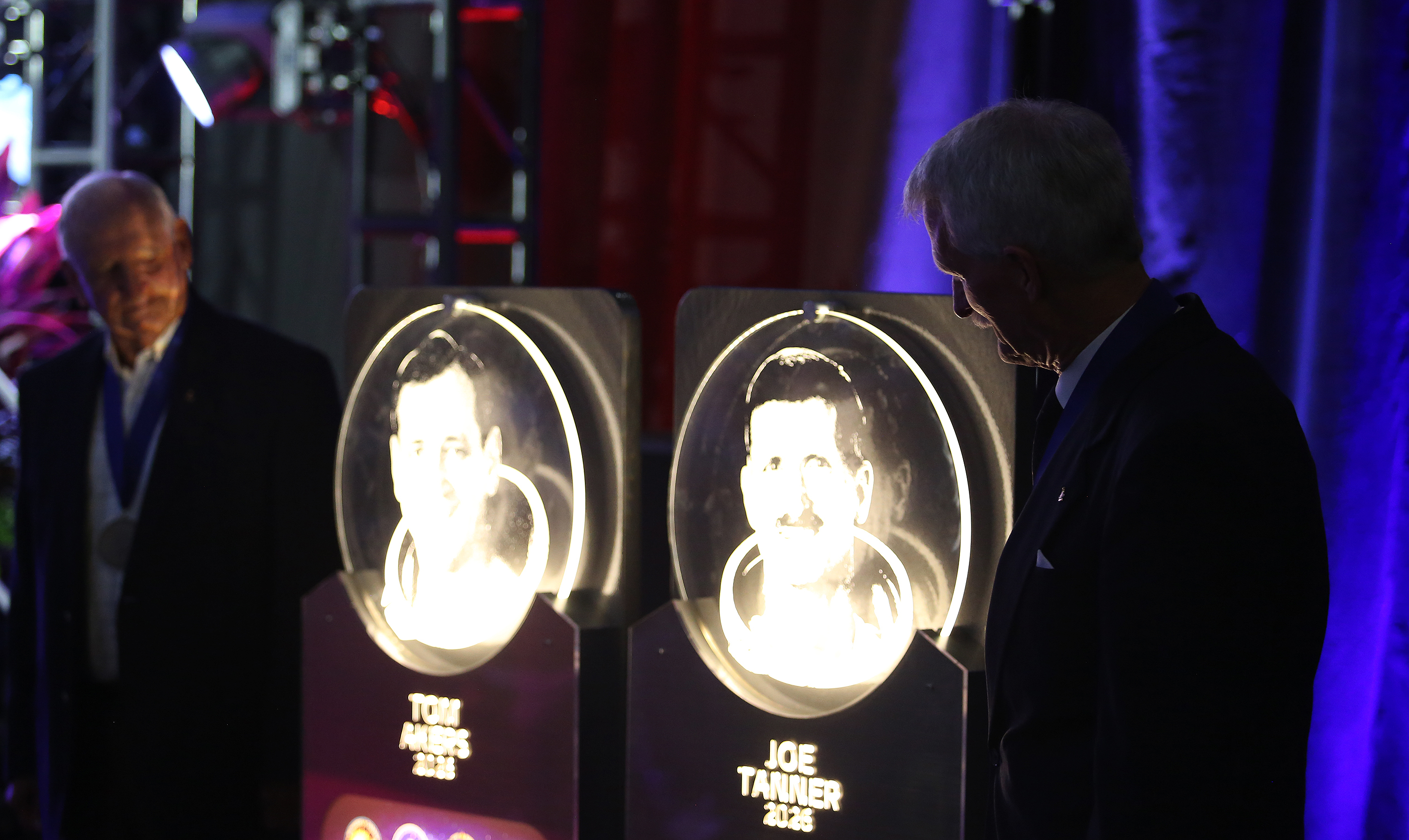Former astronauts Tom Akers, left, and Joe Tanner stand with...