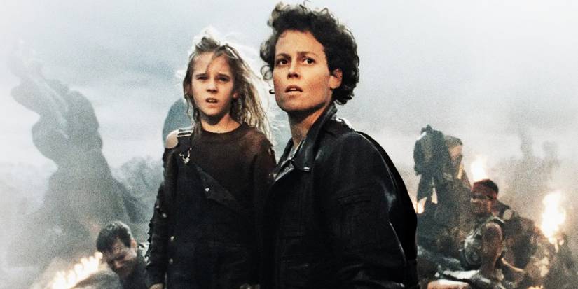 Aliens - 1986 - Ellen Ripley stands with Newt, soldiers in the background