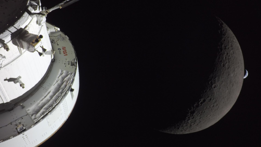 NASA Announces “Realignment” Toward Human Spaceflight A photo of the Orion spacecraft in front of a crescent of the farside of the Moon, which is in front of a crescent of the Earth in the distance