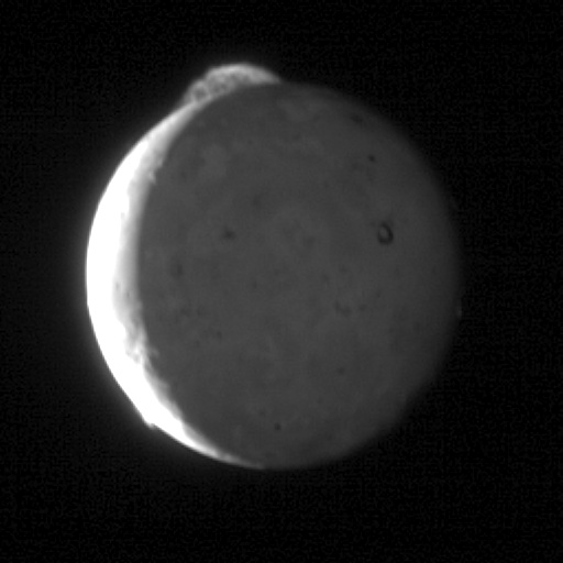 GIF sequence of five New Horizons spacecraft images, taken over eight minutes, showing Io's volcano Tvashtar erupting material 330 kilometres (210 mi) above its surface