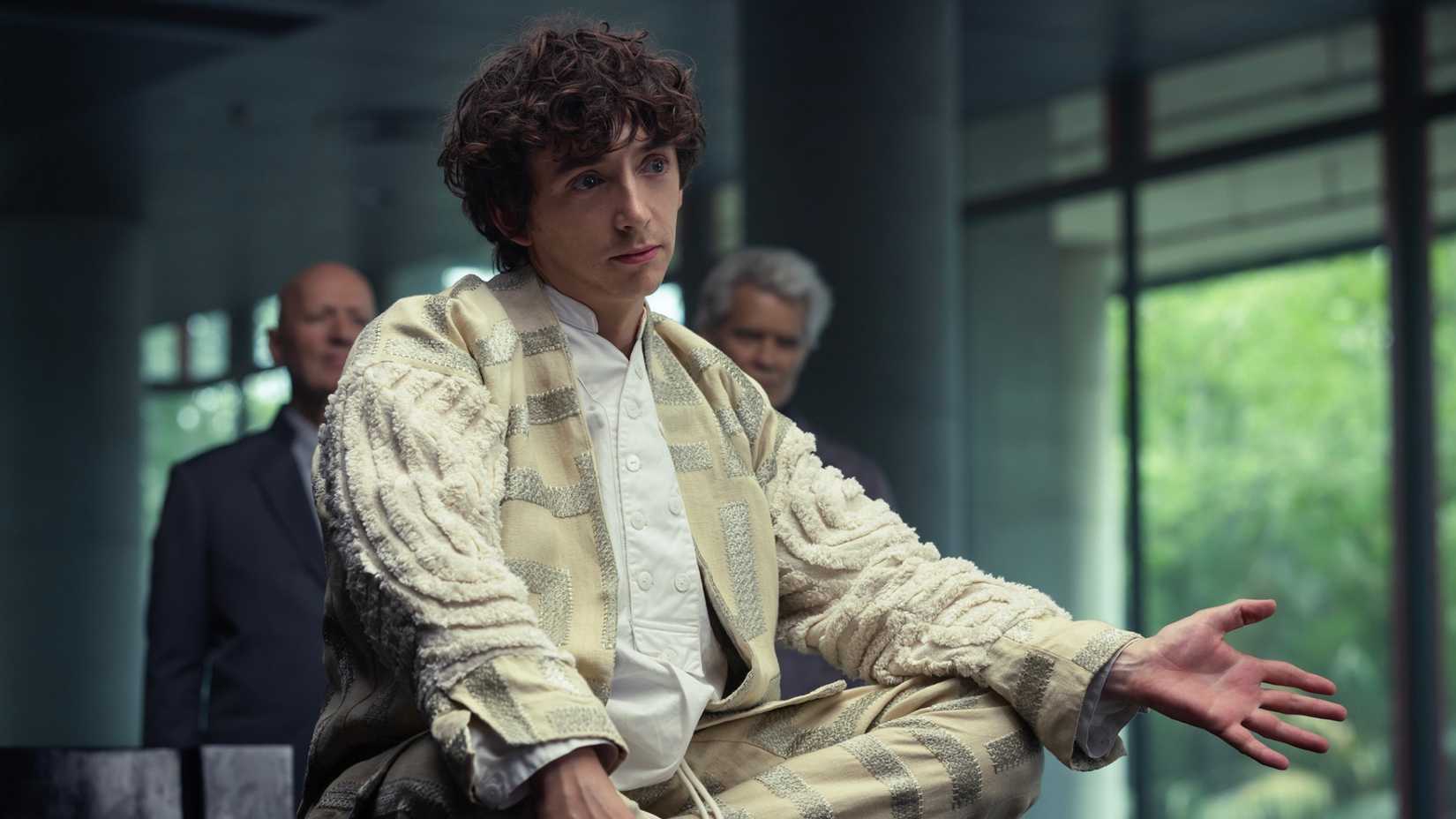 Boy Kavalier sitting on a table in Alien Earth