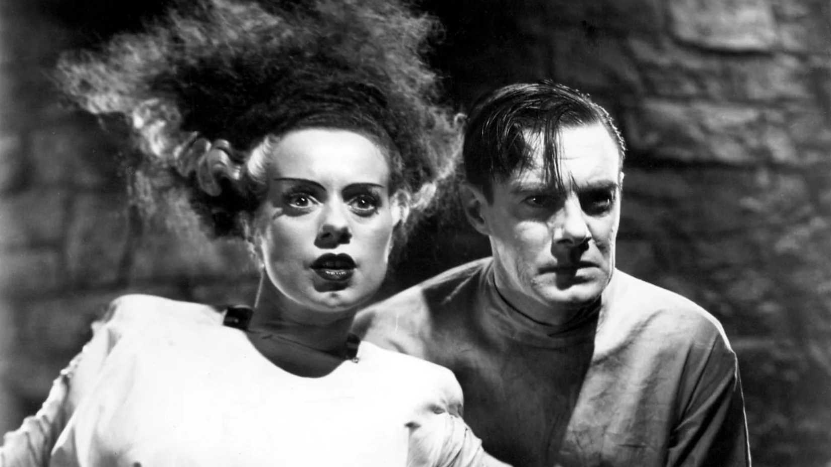 Dr. Frankenstein stands beside the Bride in Bride of Frankenstein
