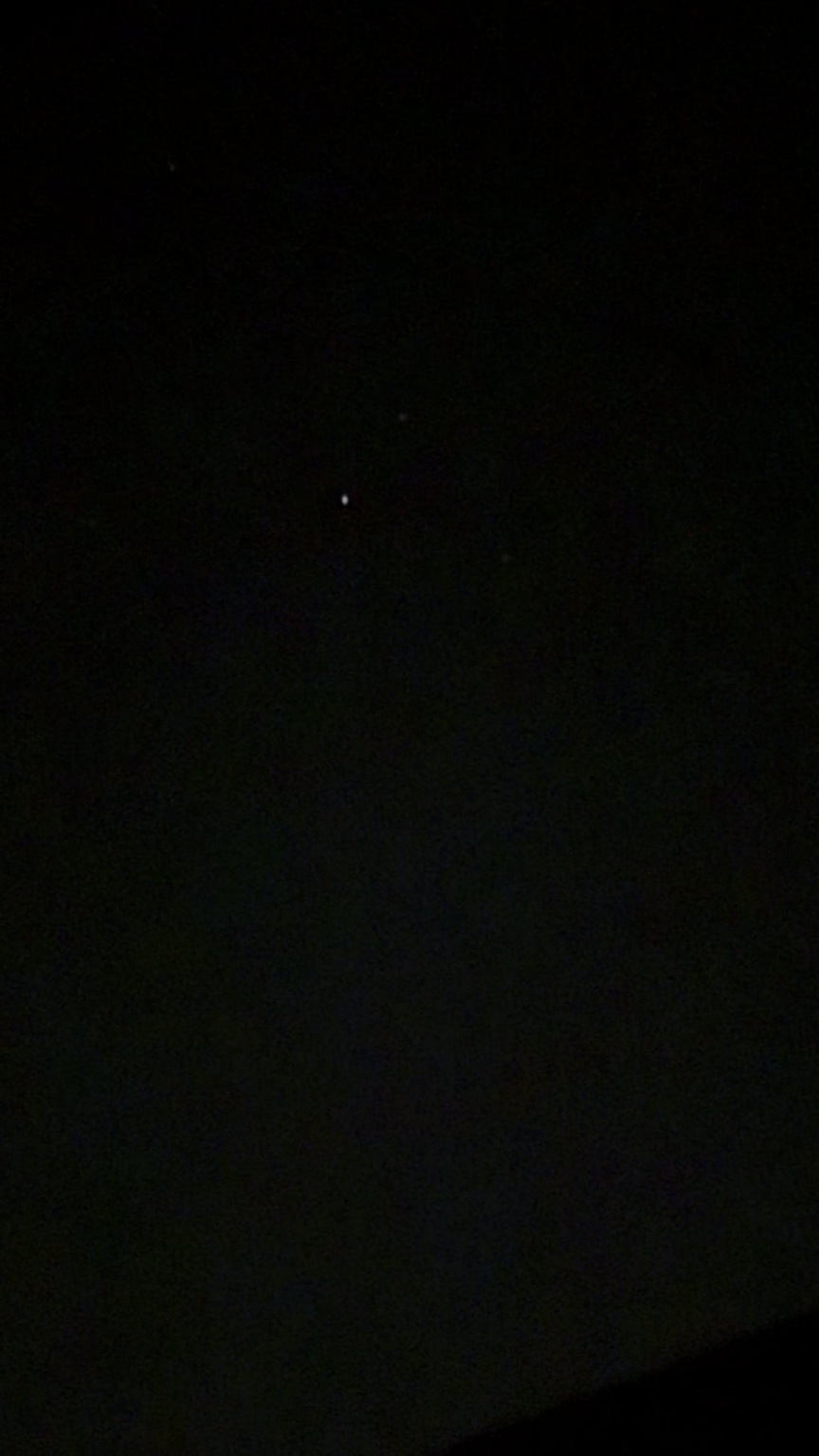 Very bright light (not where any star should be in that part of the sky) and objects flying past - taken just now UK
