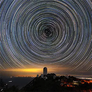 Star trails over the Mayall Telescope that houses DESI, where the biggest 3D map of the universe was created. Credit: Luke Tyas/Berkeley Lab and KPNO/NOIRLab/NSF/AURA