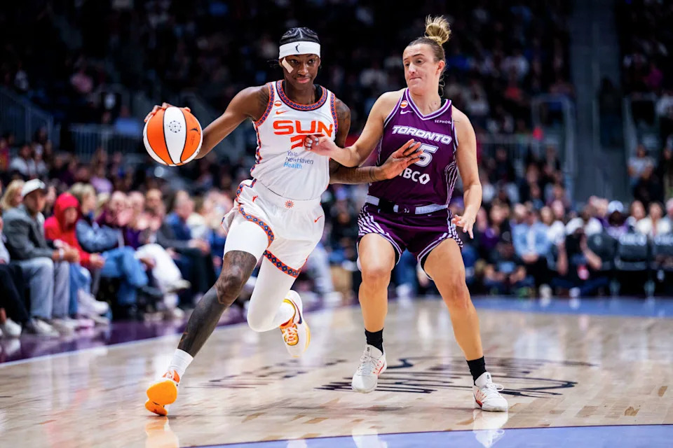 Guard Saniya Rivers (22) of the Connecticut Sun drives around guard Dara Mabrey (15) of the Toronto Tempo during the preseason game at Coca-Cola Coliseum on April 29, 2026 in Toronto, Canada. (Bailey McLean/Getty Images)