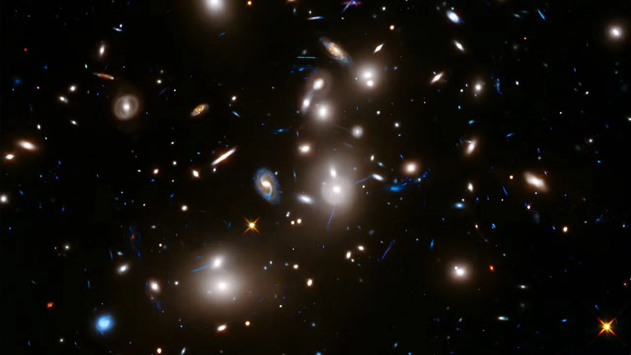 Researchers studied gravity by measuring the motion of galaxy clusters like Abell 370 in this Hubble Space Telescope image. (Image source: NASA, ESA, and J. Lotz and the HFF Team (STScI).)