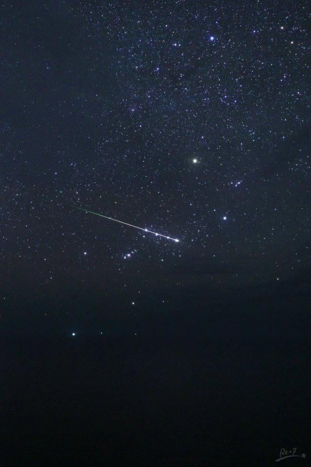 Meteor glides right along Orion's Belt