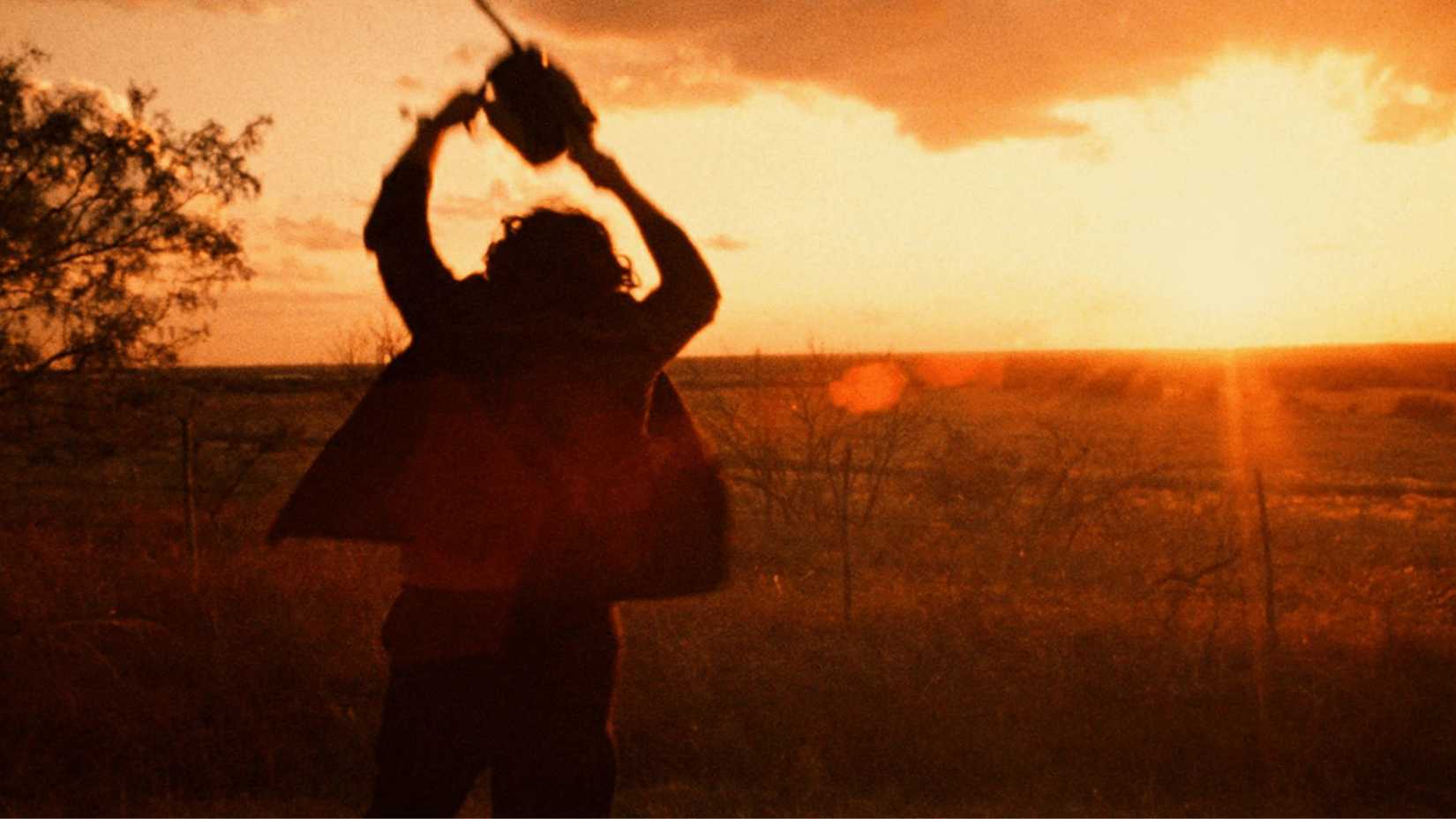 Leatherface running with his chainsaw in The Texas Chain Saw Massacre
