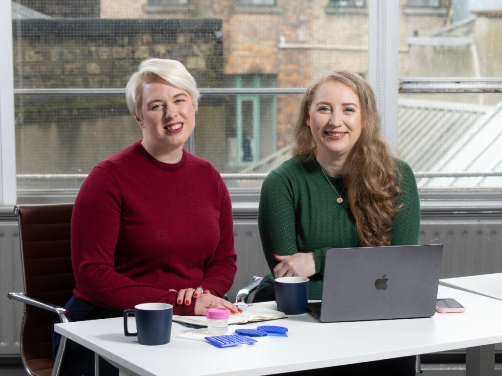 Dublin’s Lios gets renewed €2m ESA contract for its acoustic tech A woman with short, light grey hair, in a red sweater. To her right is a woman with long, light brown hair in a green sweater.