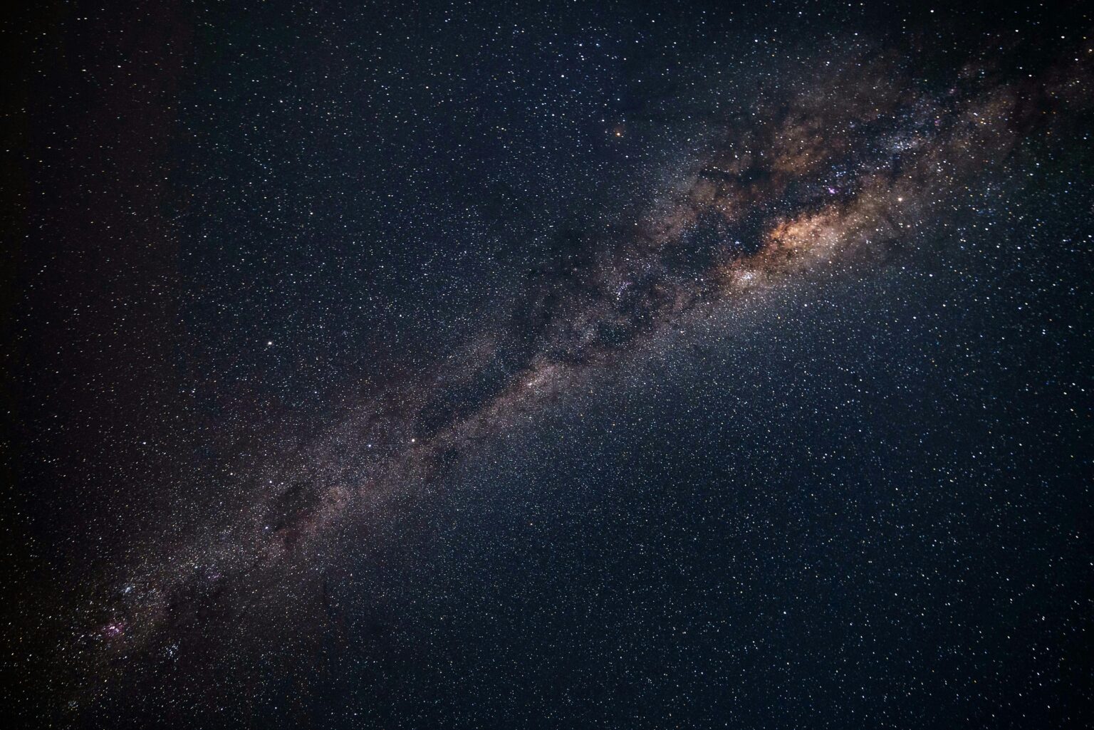 heart of our galaxy stretching across the dark sky.