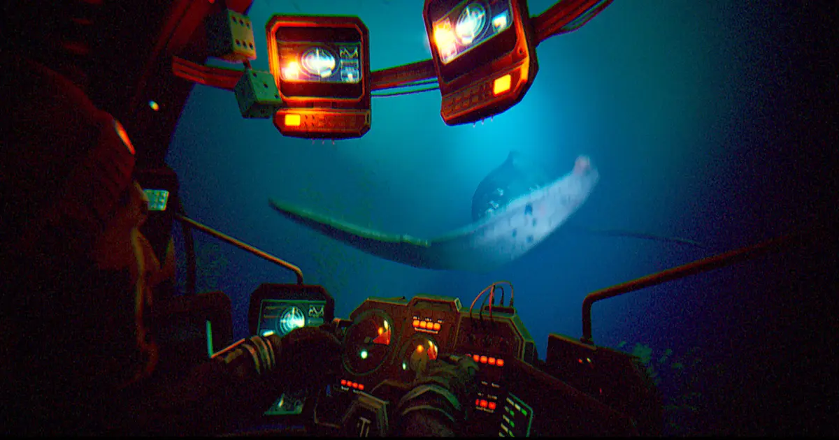 A player in a submersible controls the craft while observing a manta ray underwater.