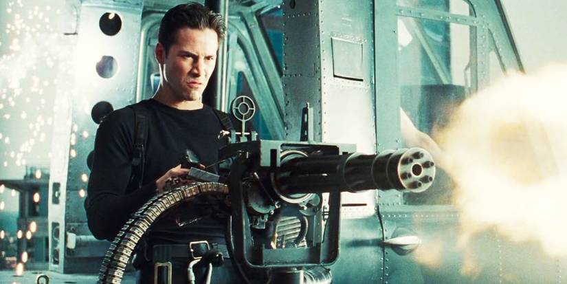 Keanu Reeves firing a minigun in The Matrix (1999)