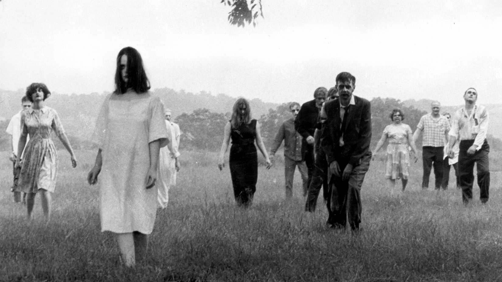 Zombies walk across a field in Night of the Living Dead