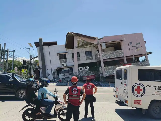 Rescuers inspect the damage after an earthquake in General Santos, Philippines