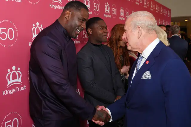 Sir Idris Elba shaking hands with the King