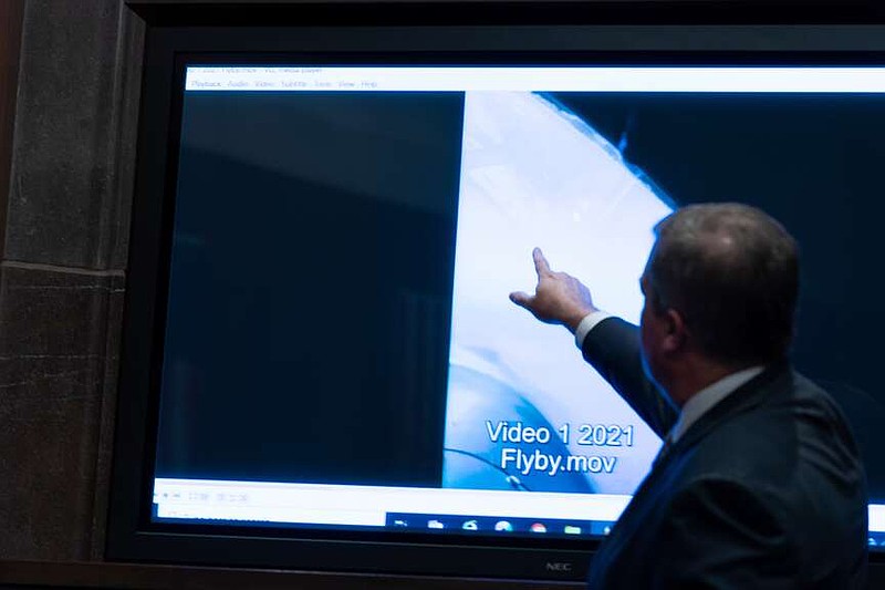 FILE - Deputy Director of Naval Intelligence Scott Bray points to a video display of a UAP during a hearing of the House Intelligence, Counterterrorism, Counterintelligence, and Counterproliferation Subcommittee hearing on 