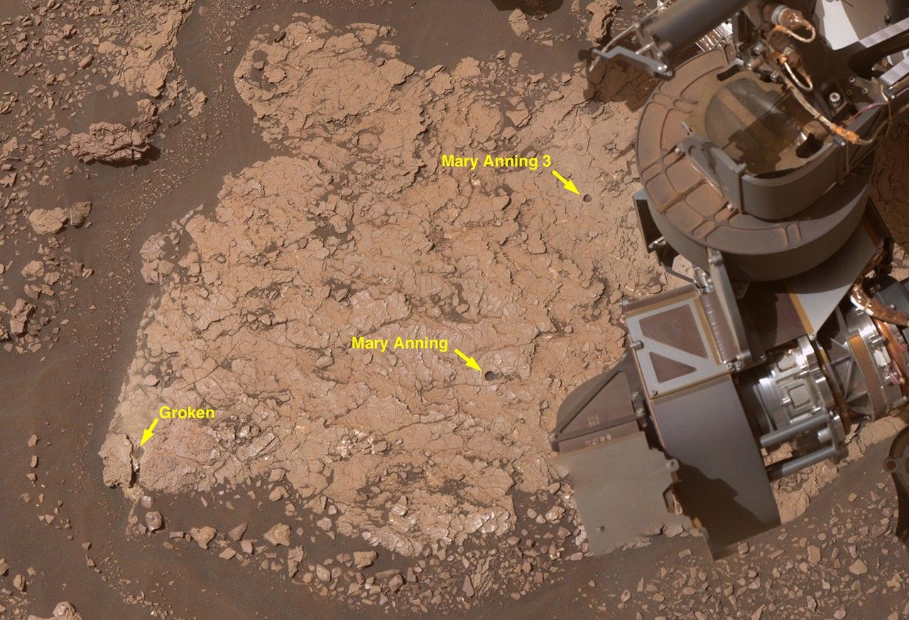 Close-up of three drill holes created by NASA’s Curiosity rover at the “Mary Anning” site in Gale Crater, where rock samples were collected for analysis. The image shows the rover and text marking the three drill holes, Groken, Mary Anning and Mary Anning 3