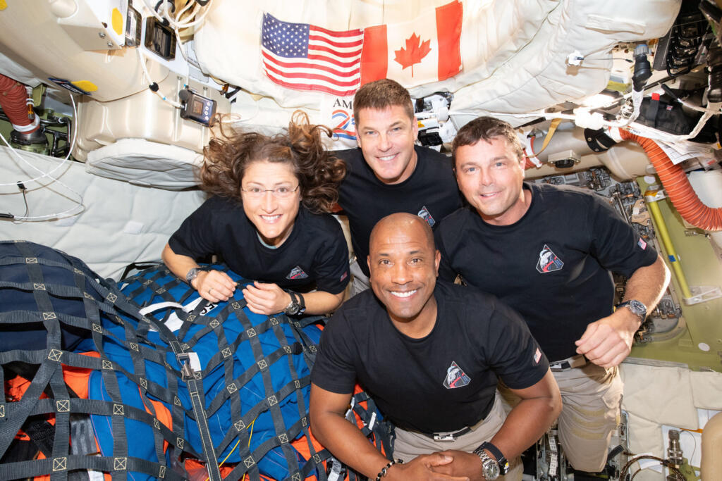 NASA via AP In this image provided by NASA, the Artemis II crew, clockwise from left, Mission Specialist Christina Koch, Mission Specialist Jeremy Hansen, Commander Reid Wiseman, and Pilot Victor Glover, pause for a group photo inside the Orion spacecraft on their way home on Wednesday, April 7, 2026. (NASA via AP)