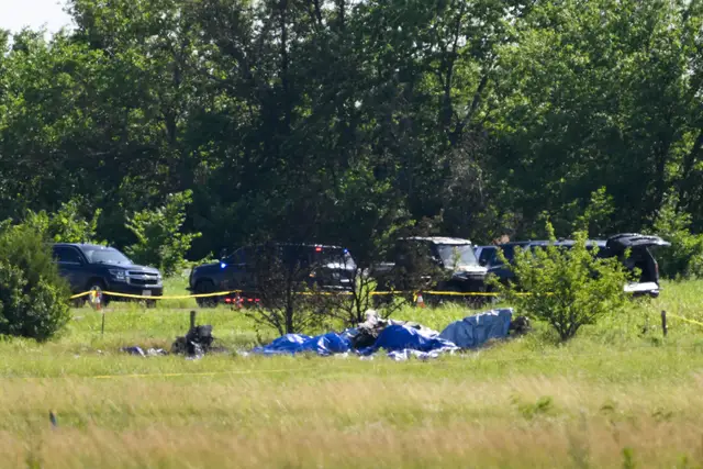 Part of the wreckage of a plane crash in a field