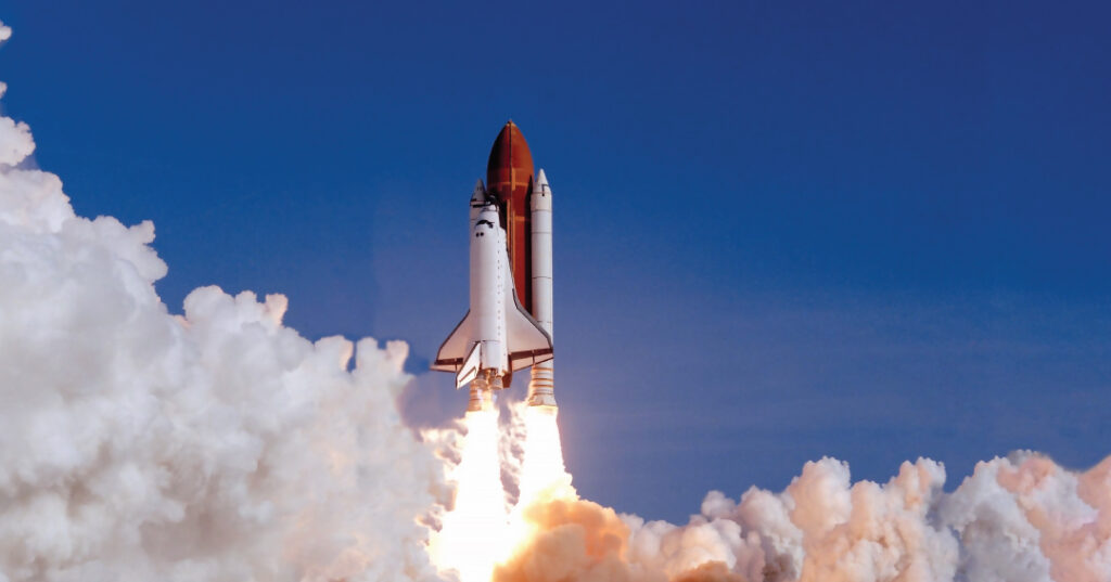 Awards recognize excellence in aerospace research, STEM outreach and future contributions to NASA’s mission a space ship takes off with a blue sky and a large cloud of smoke