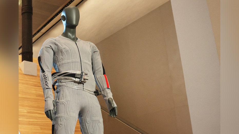 gray spacesuit lining on manequin 