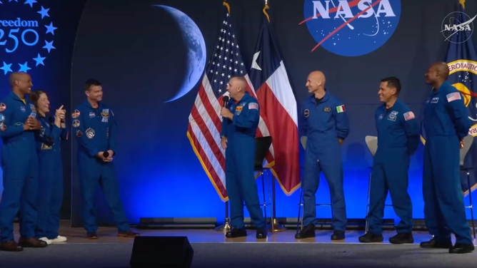 Artemis II astronauts Reid Wiseman, Christina Koch and Victor Glover come on stage with Artemis III crew Randy Bresnik, Luca Parmitano, Andre Douglas and Frank Rubio.