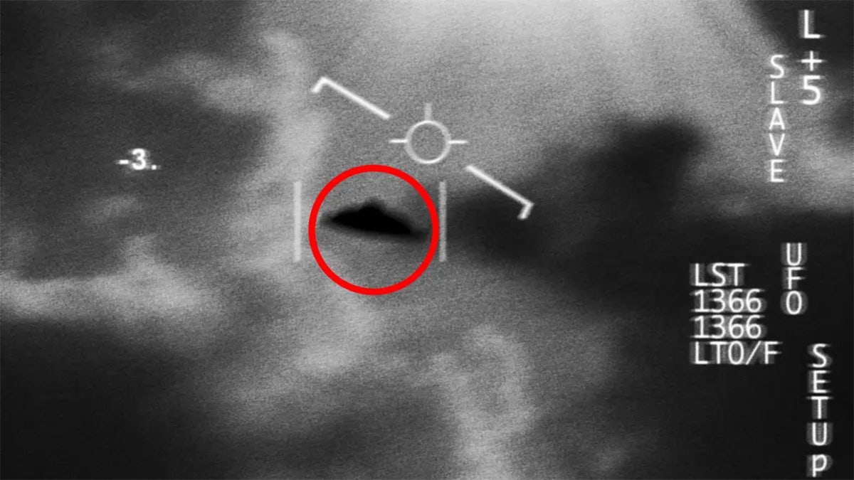 A declassified image showing a UFO in flight against the sky.